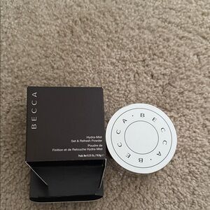 BECCA Hydra-Mist Powder in Black and White Packaging